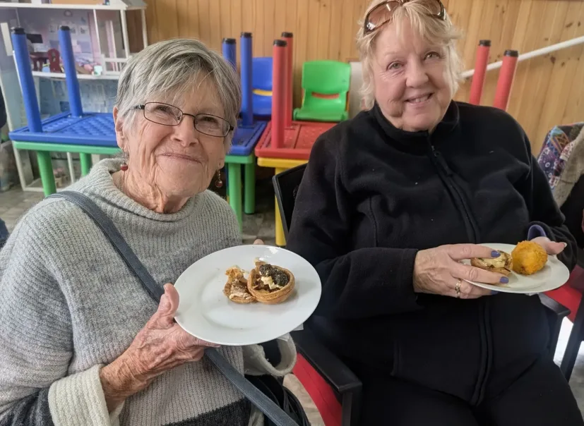 Community members enjoying a meal together