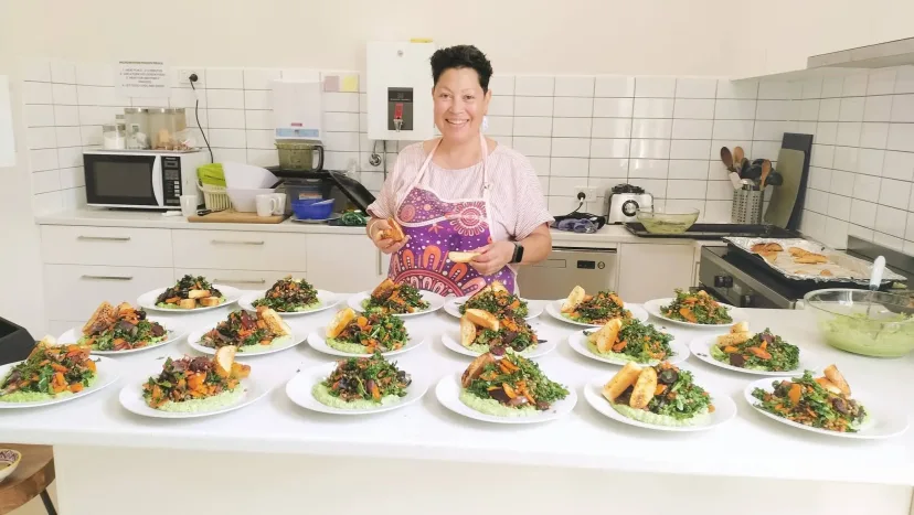 Emma, our chef, with the community lunch plated up in the Mitchell House kitchen
