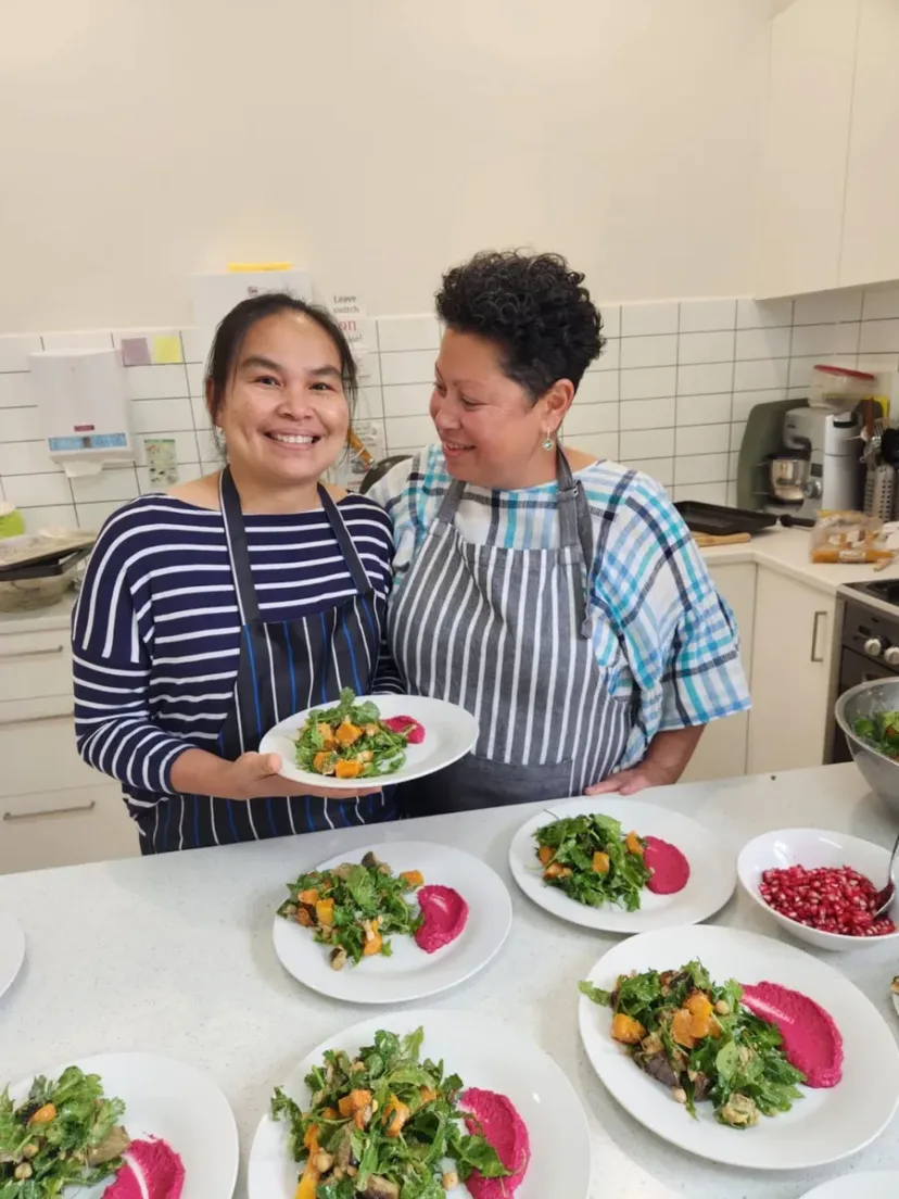 Volunteers serving fresh meals at the community lunch