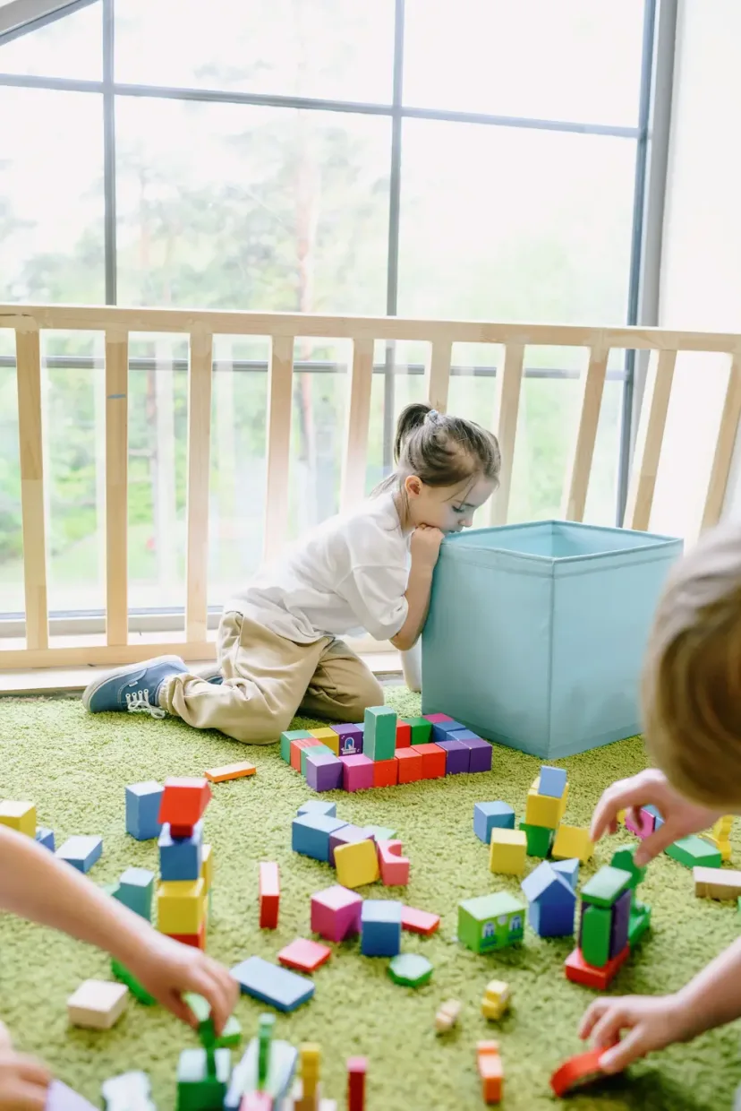 A parent and young child playing together at playgroup